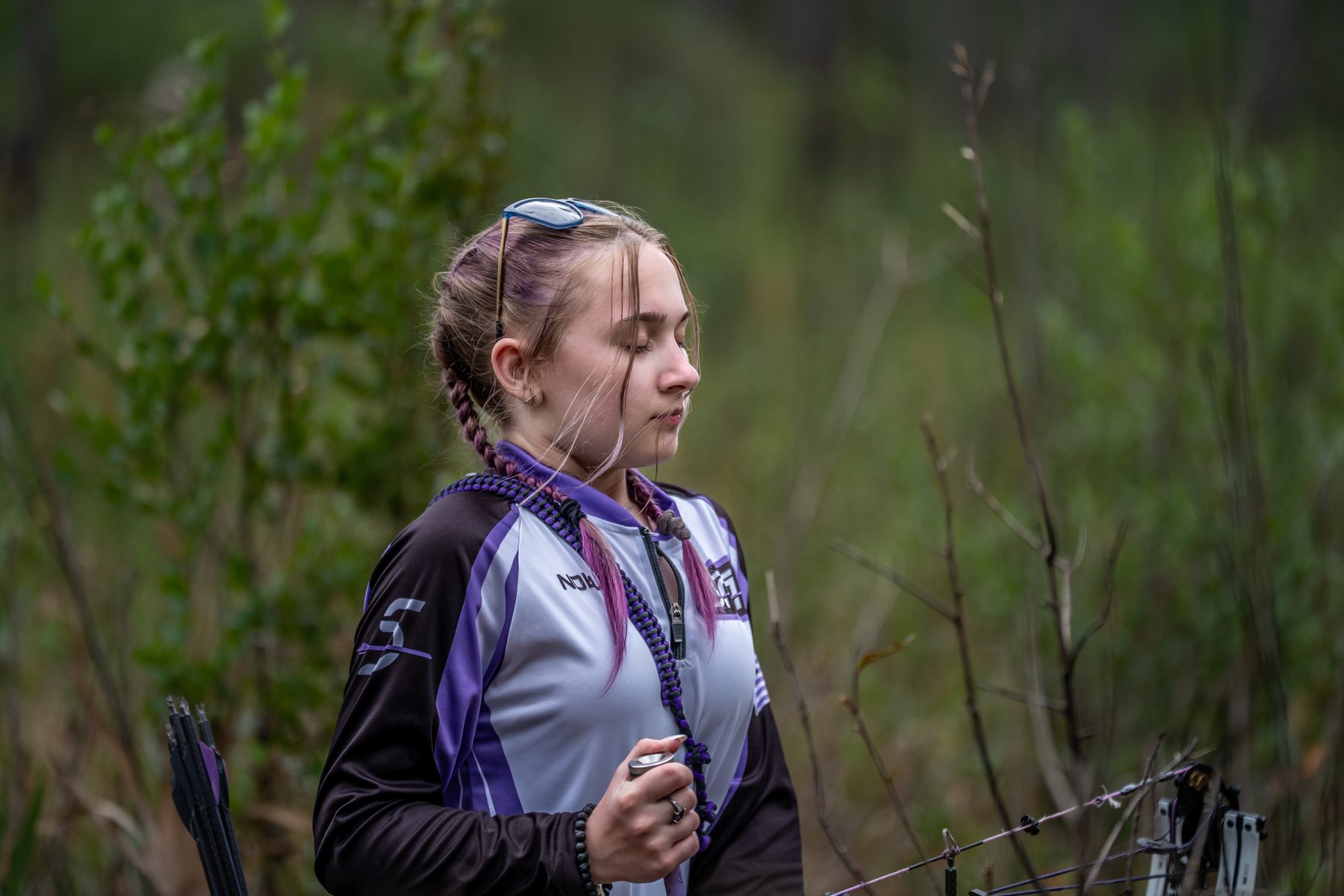 Archer using deep-breath focus technique during NTS mental preparation at Sarasota Archery Academy