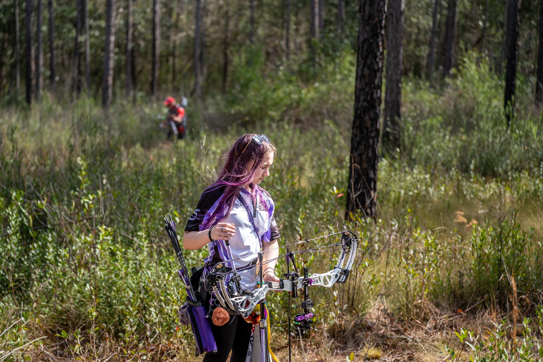 Archer in mental preparation phase of NTS shot routine — Sarasota Archery Academy coaching
