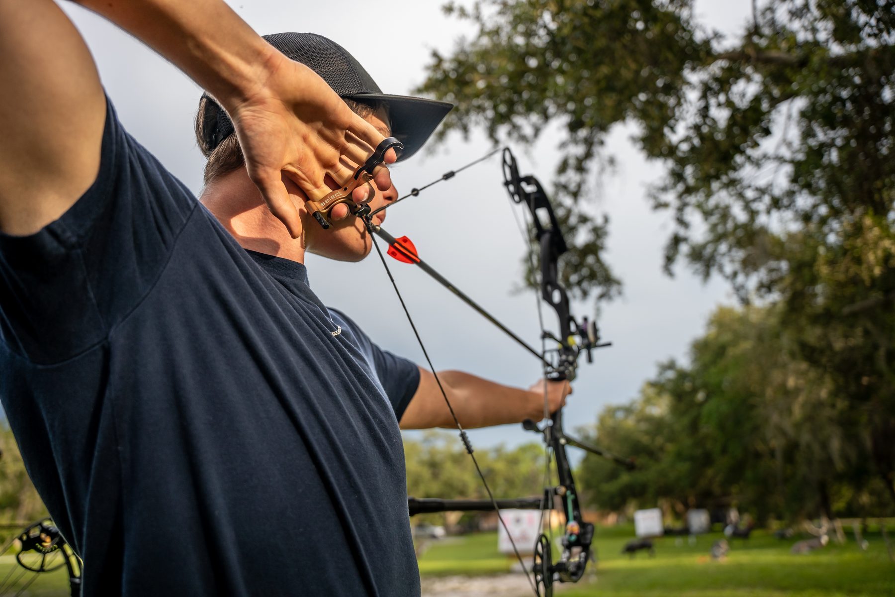 Compound bow fitted to archer during equipment consultation at Sarasota Archery Academy